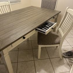 Dining room table   With 4  chairs  drawers for silverware