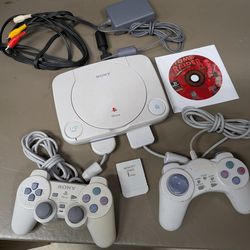 Psone PlayStation 1 with 2 controllers, memory card and tomb raider 2