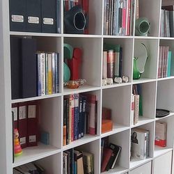 Book Shelf / Room Divider. Ikea Kallax shelf unit in white color. 