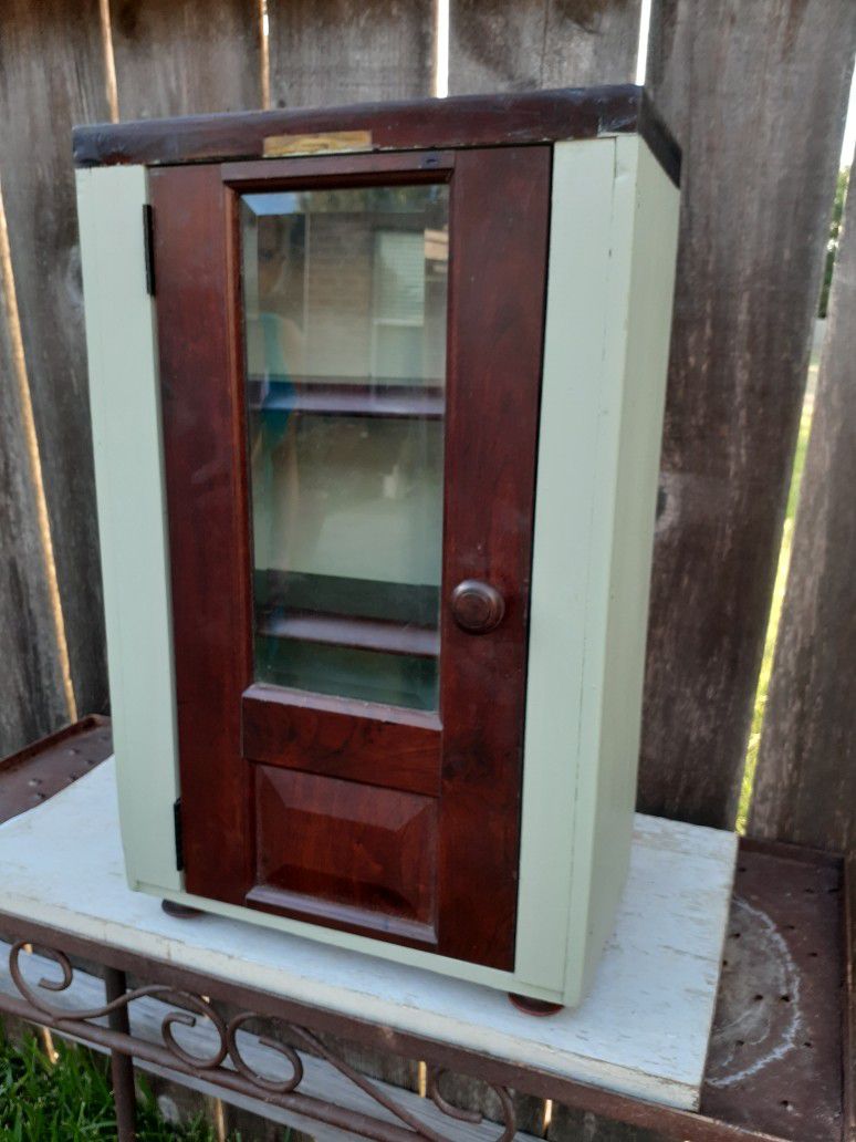 Handcrafted small antique cabinet