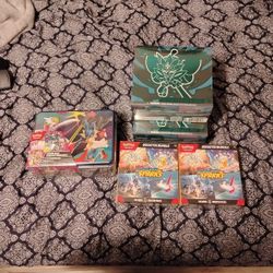 1 Phantasmal Flames Lunch Box, 2 Surging Sparks Booster Boxes & 2 Twilight Masquerade ETBd