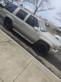 2000 Cadillac, escalate.