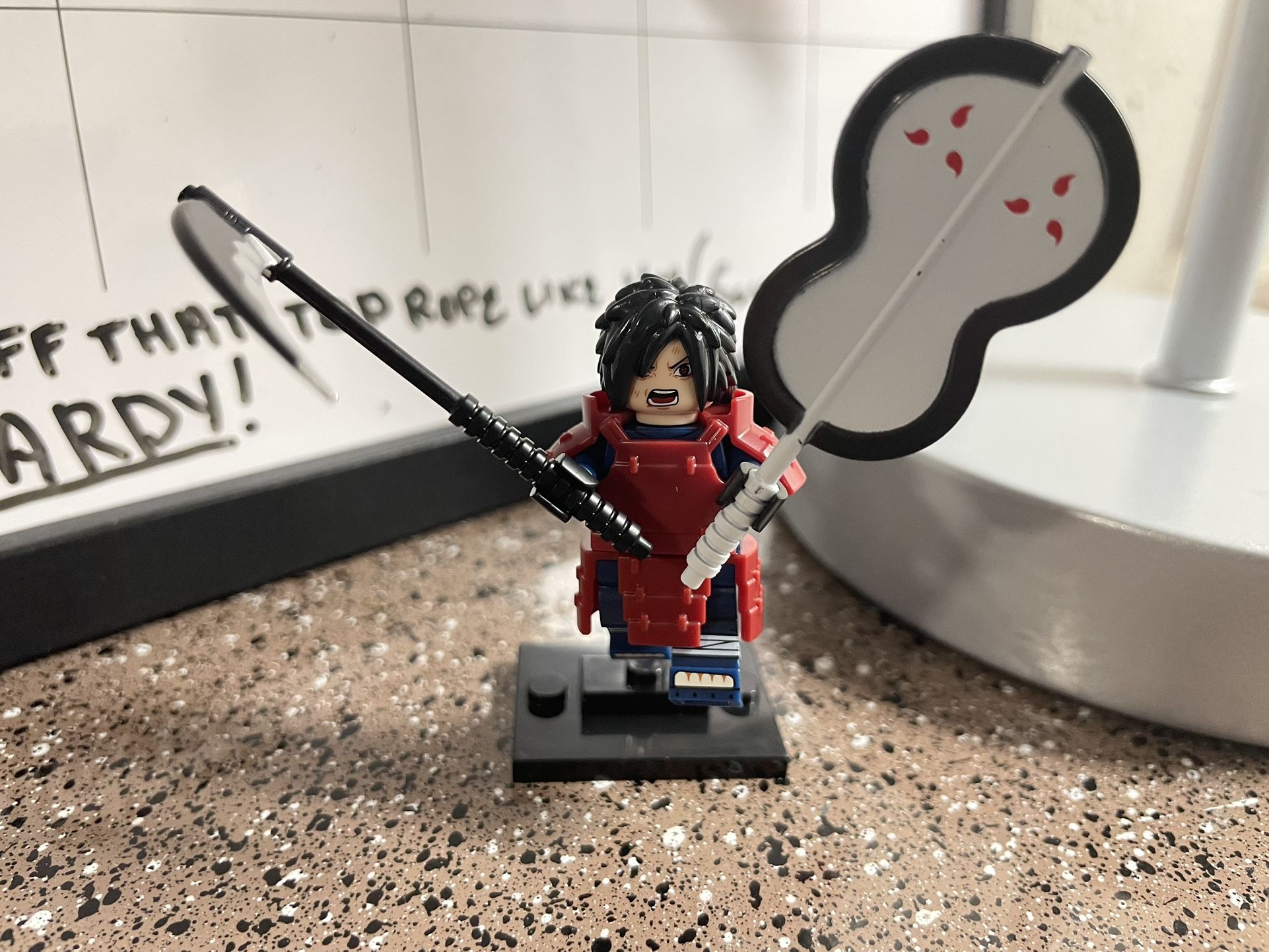 Madara Uchiha with two iconic weapons: a scythe and a large fan Minifigure