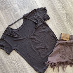Dark gray open back T-shirt.