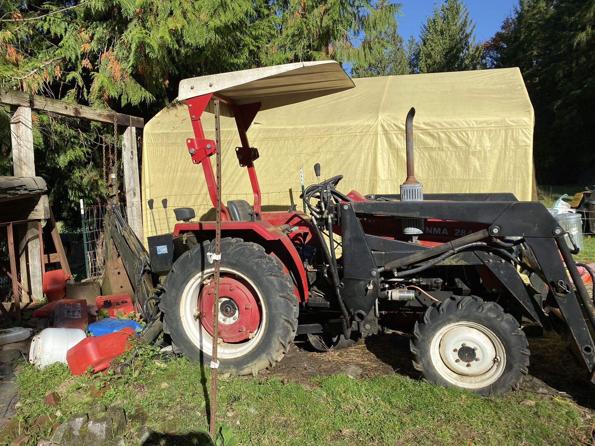 Jinma 284 tractor with backhoe attachment