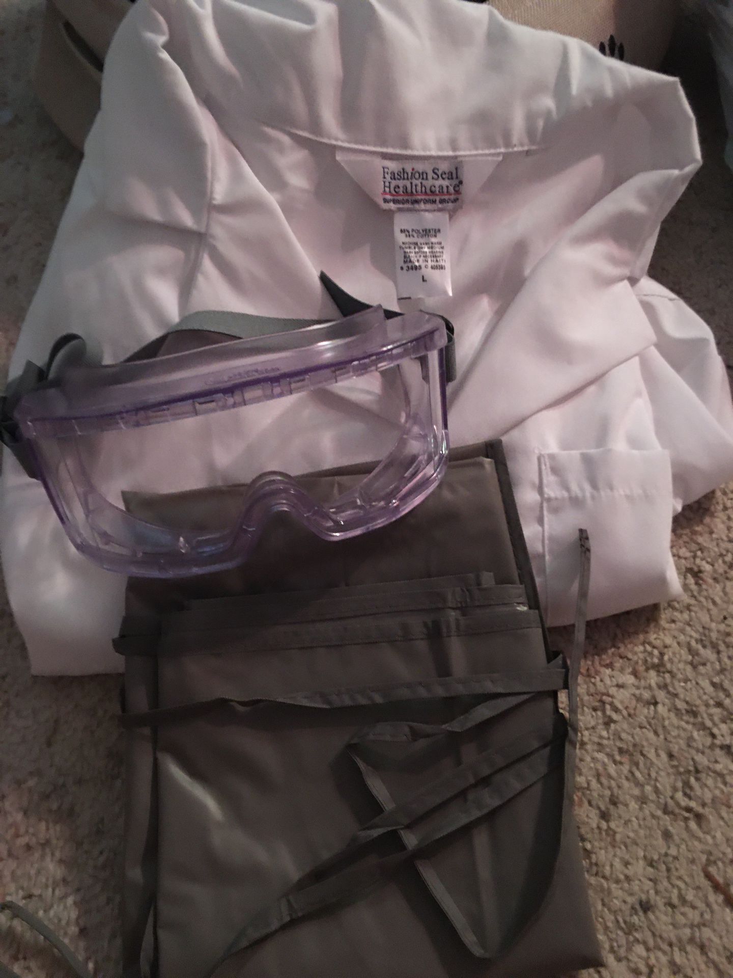 chemistry lab coat, apron, and lab goggles