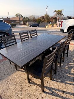 Black dinning table with six chairs
