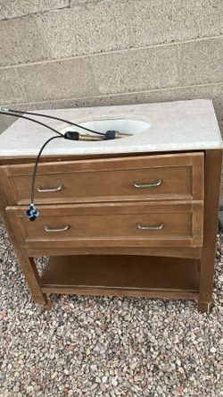Bathroom vanity with sink and faucet