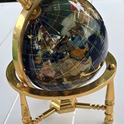 Globe Mini Gemstone Inlay Globe on Brass Stand – Lapis Lazuli Ocean
The deep blue oceans swirl in rich, inky lapis, The globe spins smoothly 