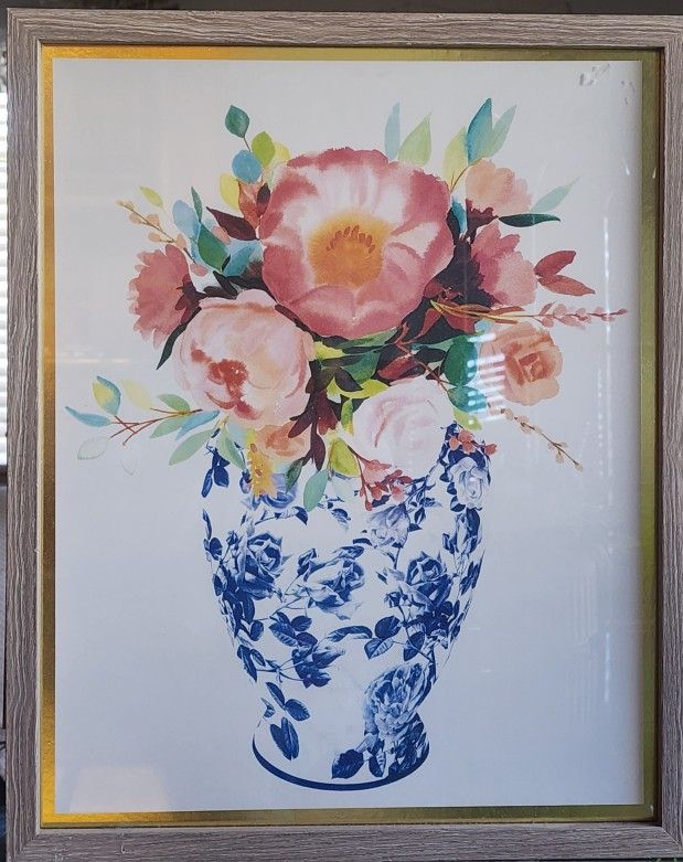 pink flowers in a blue and white vase with a light wood frame. Wide: 17" Long:21"