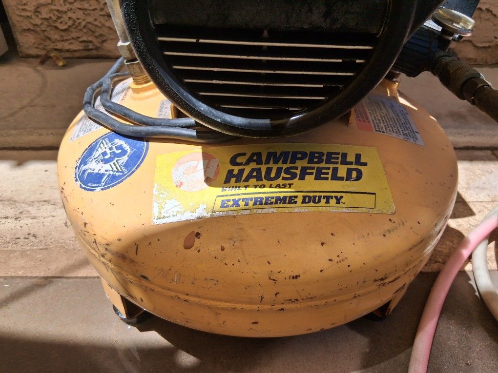 Air compressor electric with hose.