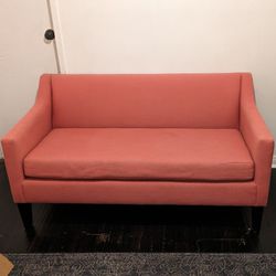 Pink West Elm loveseat couch