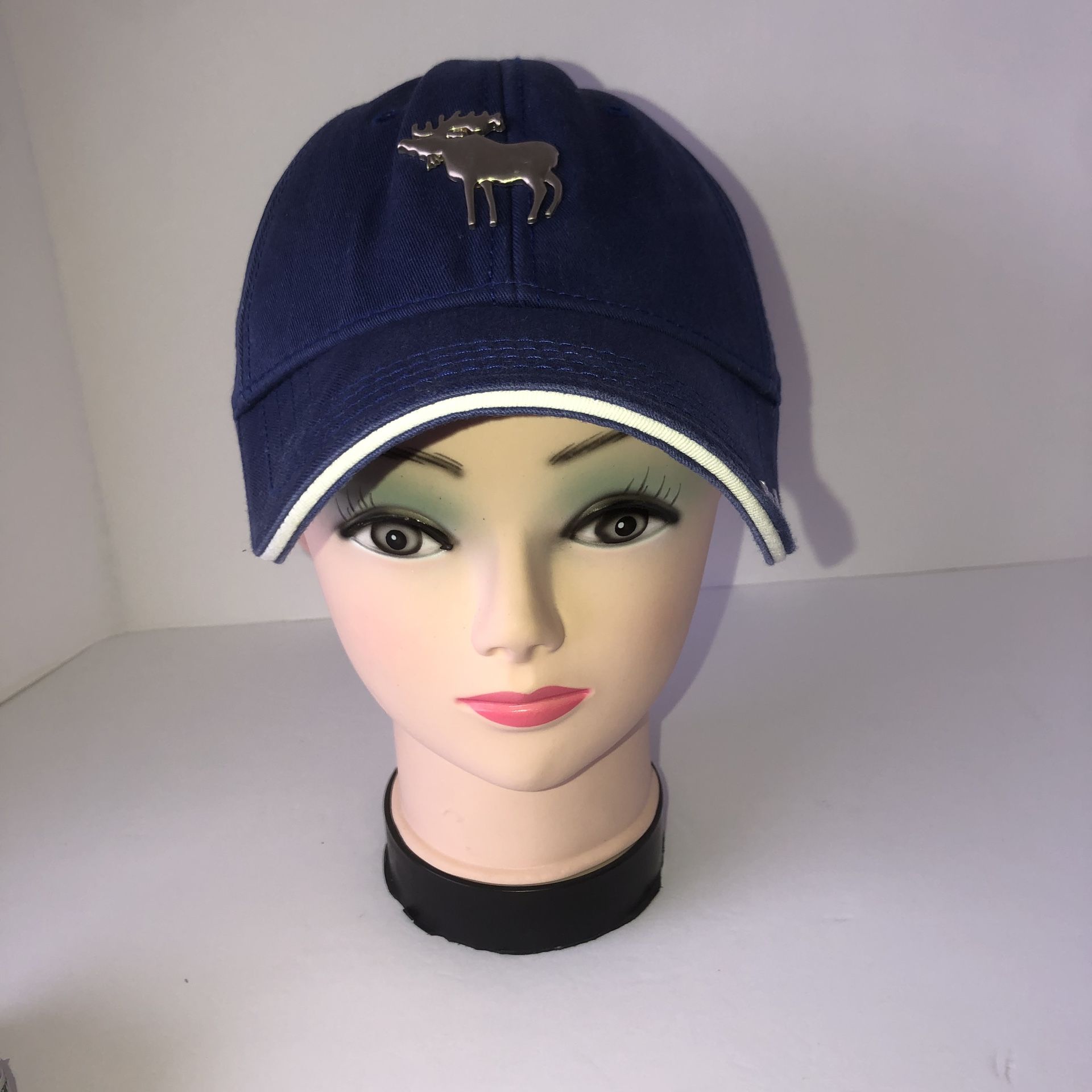 Navy blue & white adjustable Colorado hat with a silver metal moose. One size fits most