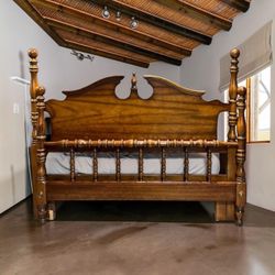Queen-Size Wood Bed Frame With Turned Posts and Decorative Headboard\