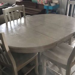 Free table chairs not included. Needs painting.
