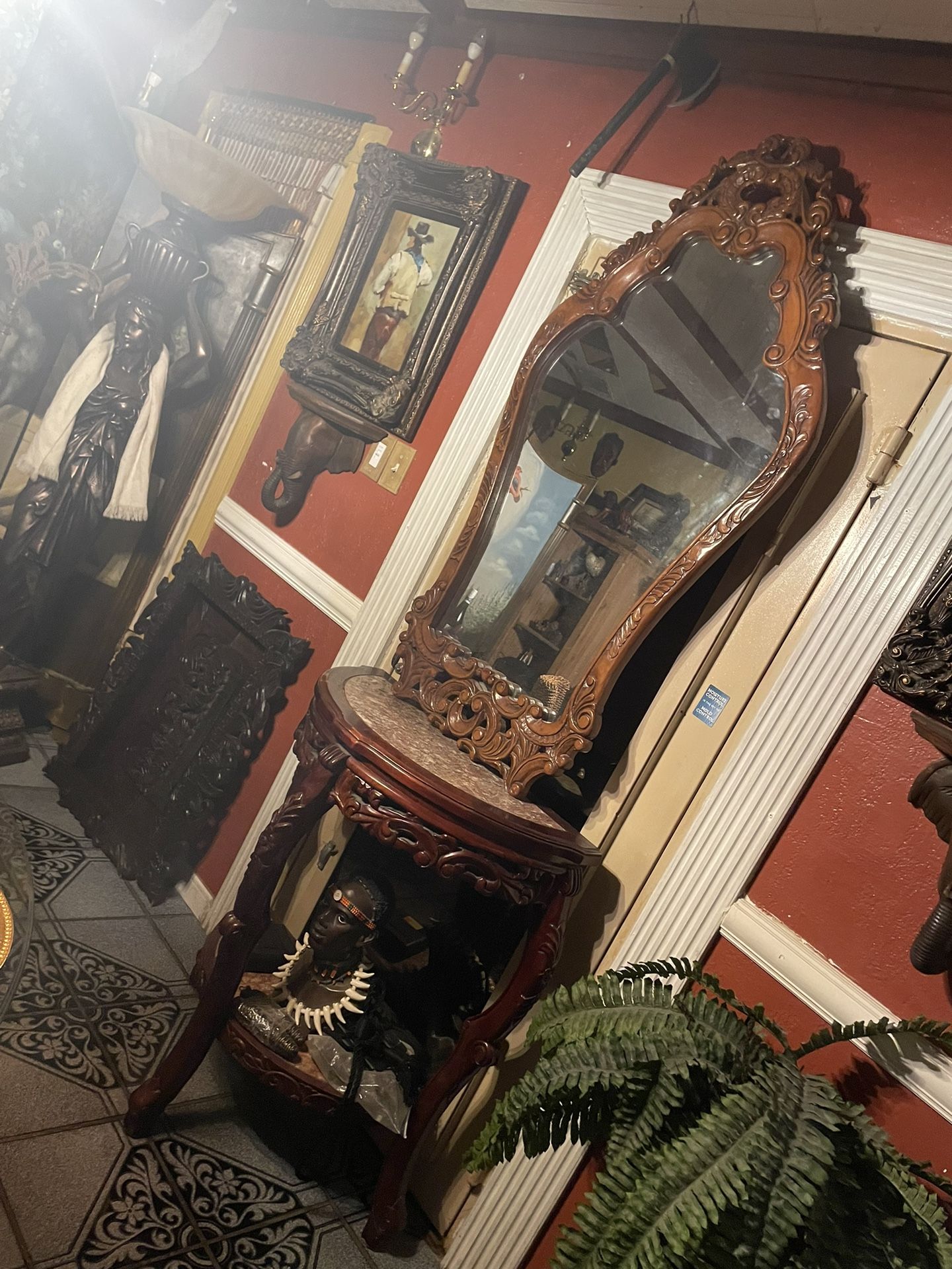 Hand carved entrance table set 2 Pieces: table & Mirror Table is 2 Tiers Marble top 36in H By 30inW By 18inD Mirror is: 54in H by 30in W Solid hand ca