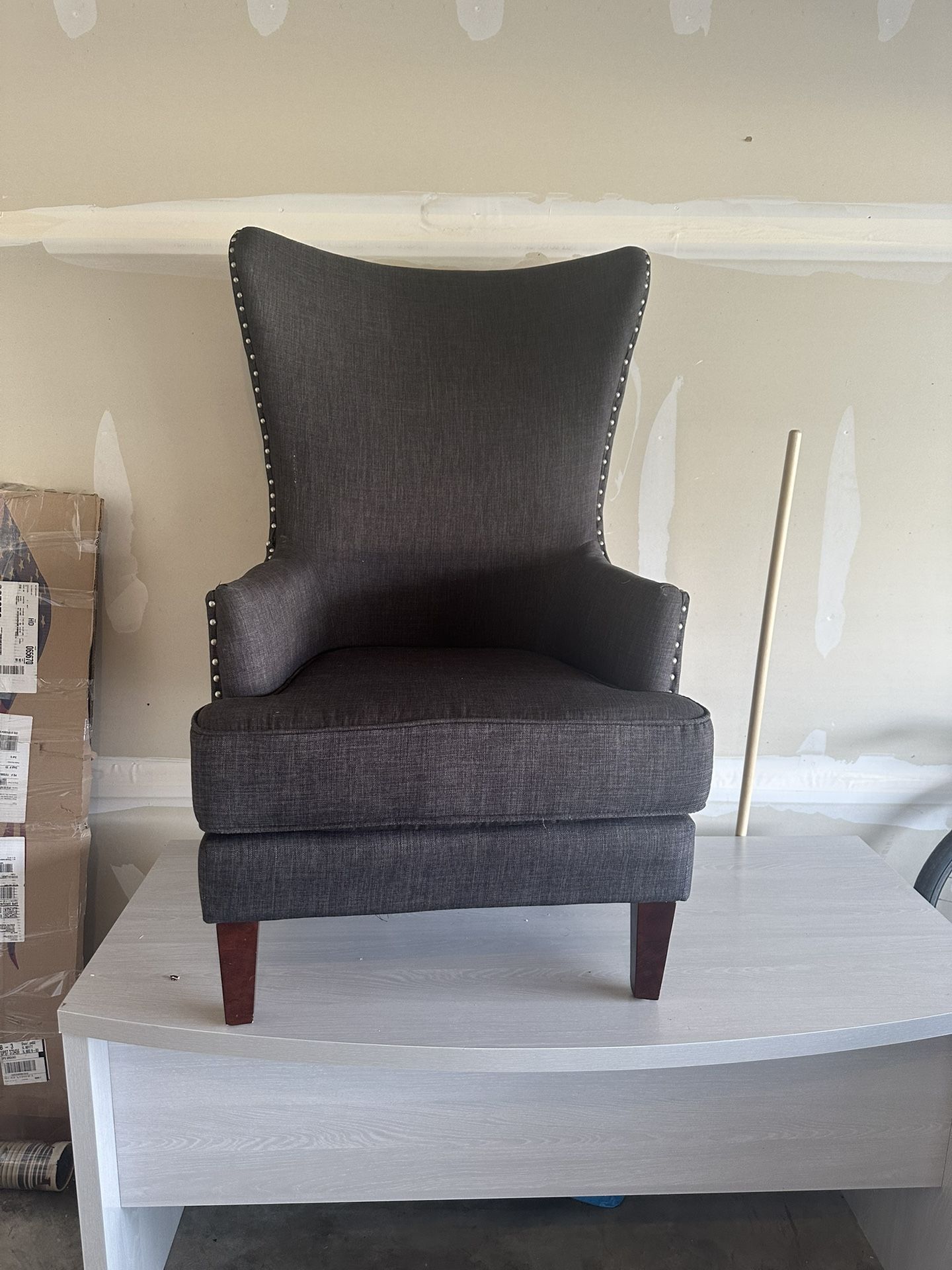 Modern Wingback Accent Chair with nailhead trim.