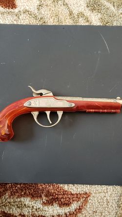 Flintlock junior toy cap gun.