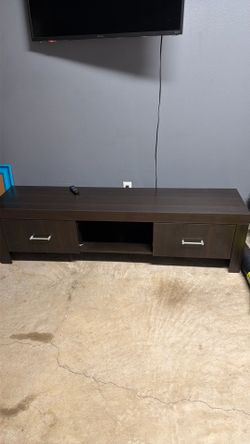 Rooms To Go…70 in Wood Entertainment Center/TV Stand (2 Deep Drawers)  (very Sturdy)