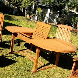 #3 Oval patio Teak Table w/ leaf extension Grade A  Solid Teak, 4 folding  Armchairs.  No damage to the table or chairs. 94"Lx43"W×29"H