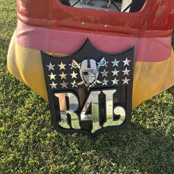 Raiders For Life Ornament Has Glass Stars And Also The Helmet Is Made Of Glass With A Face Made Of Glass The Black Background