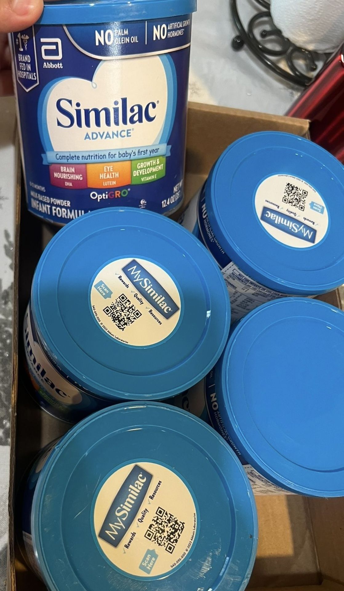 Multiple Similac Blue Cans