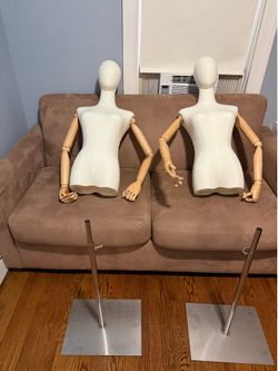 2 wood clothing racks and 2 mannequins