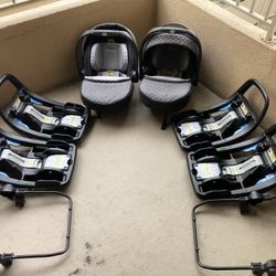 Selling (2) SnugRide® SnugFit 35 Elite Infant Car Seats with (4) bases and (2) stroller attachments.