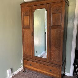 Antique oak wood armoire wardrobe with mirror