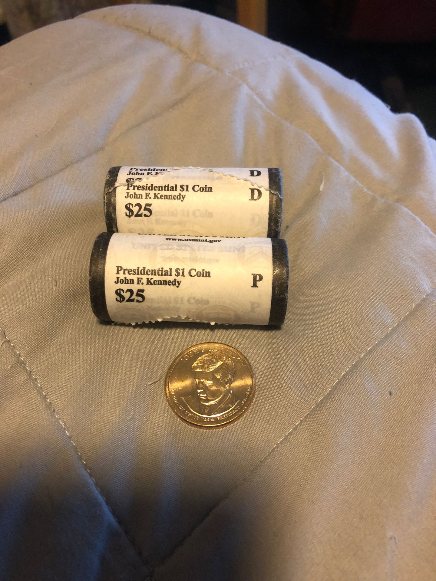 Two bank rolls of 2015 (P&D) Kennedy Golden Dollars. Very popular and getting harder to get.
