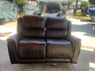 Leather  reclining love seat $250 O.B.O