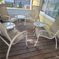 Four Chairs And Three Tables