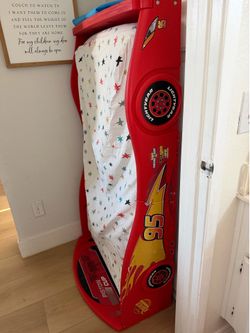 Toddler bed with mattress and sheet