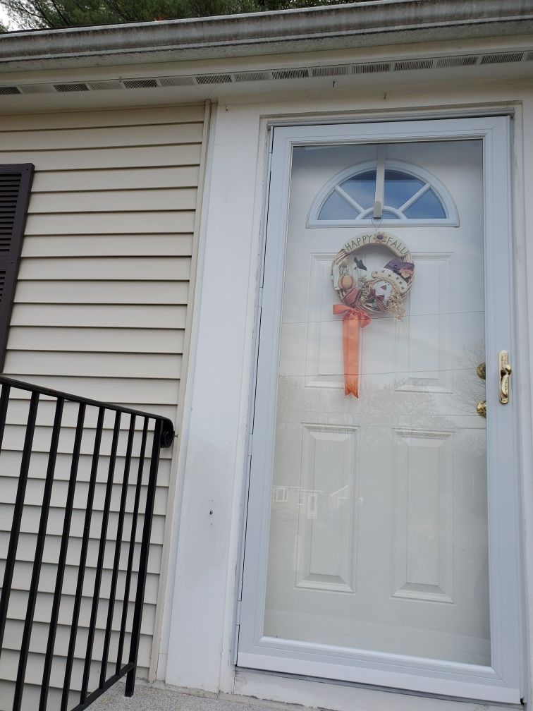 Storm door with brass Anderson handle