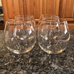 Brand New Never Used perfect Condition Set of 4 Stemless Glasses.  Made of Glass. Capacity 20 ounces.  Size 4 inches tall and 3 inches wide across the