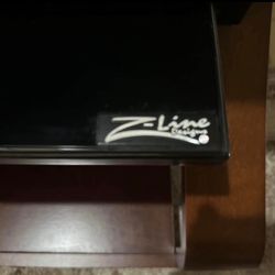 Sleek Z-Line Designs TV stand. 

Modern TV Stand with Glass Top & Wood Base