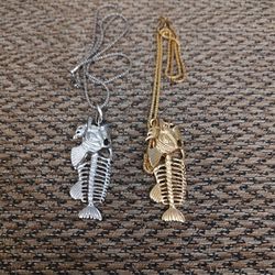 SKELETON FISH NECKLACE.  24 IN. CHAIN. $10 EACH.   NEW. PICKUP ONLY