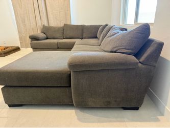 Gray sectional sofa with chaise lounger