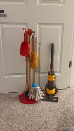 Kids play cleaning supplies