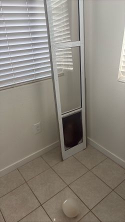 Insert for sliding glass door pet door.