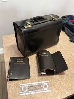 Vintage pilot briefcase with decals monogram and badges plus leather air manual binders