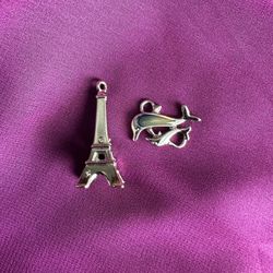 2 lovely silver-tone PENDANTS, CHARMS. EIFFEL TOWER & 2 DOLPHINS. Never worn.