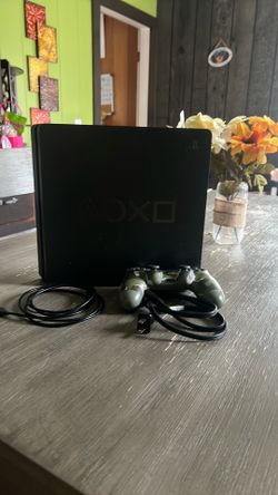 PS4 with cords and controller and games