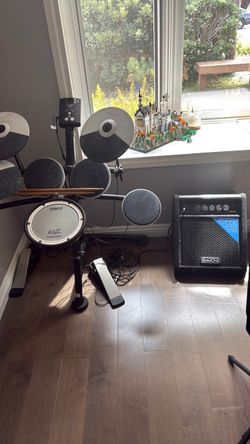 Roland’s V drums  electric with Simmons DA50 amp subwoofer
