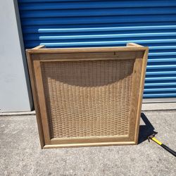 These vintage rattan nightstands are likely from the mid-century era, featuring wicker drawer fronts and wooden frames. They are suitable for vintage 