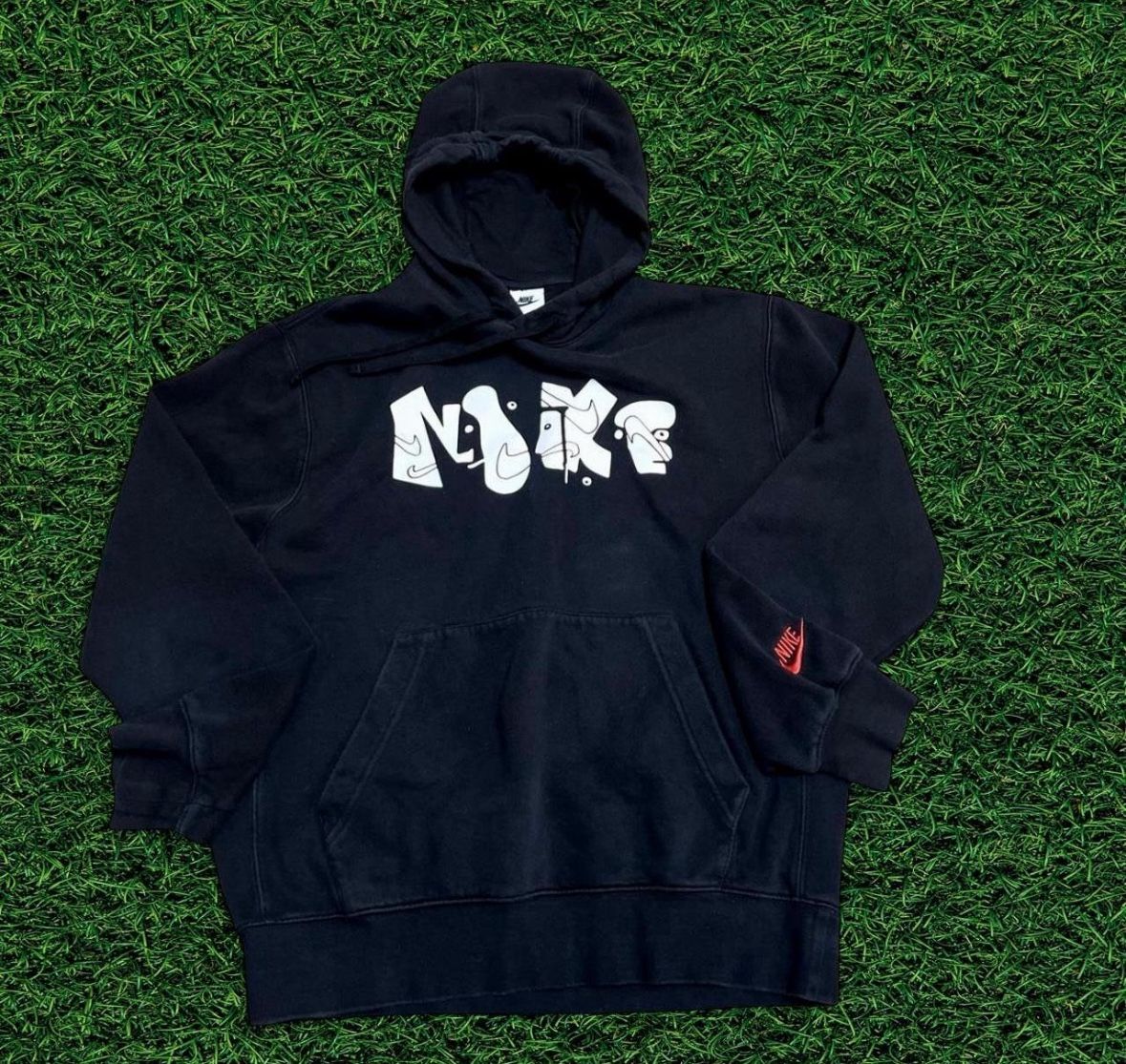 Black Nike hoodie with white graffiti spellout #skater