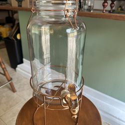 Glass drink dispenser with metal stand