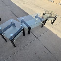 Three piece coffee table and end table set