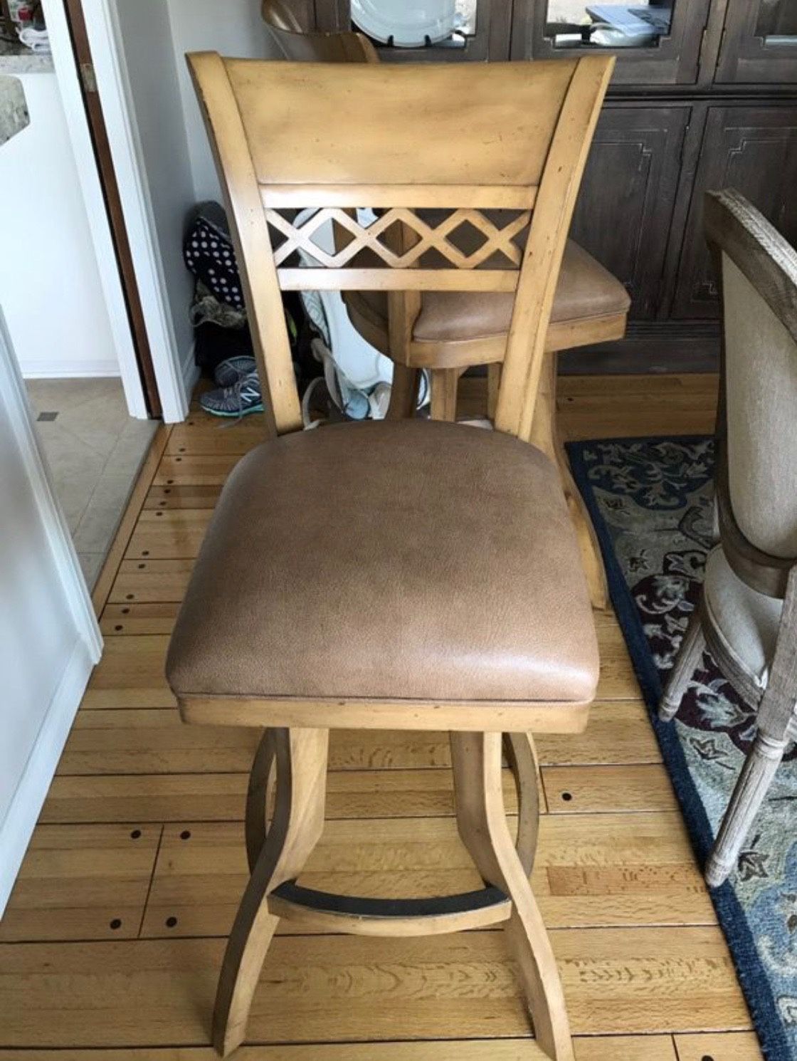 2 high back solid walnut barstools with leather seating