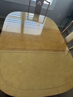 Nice table 4 chairs and custom cover and chair cushions and xtra leaf seats 6